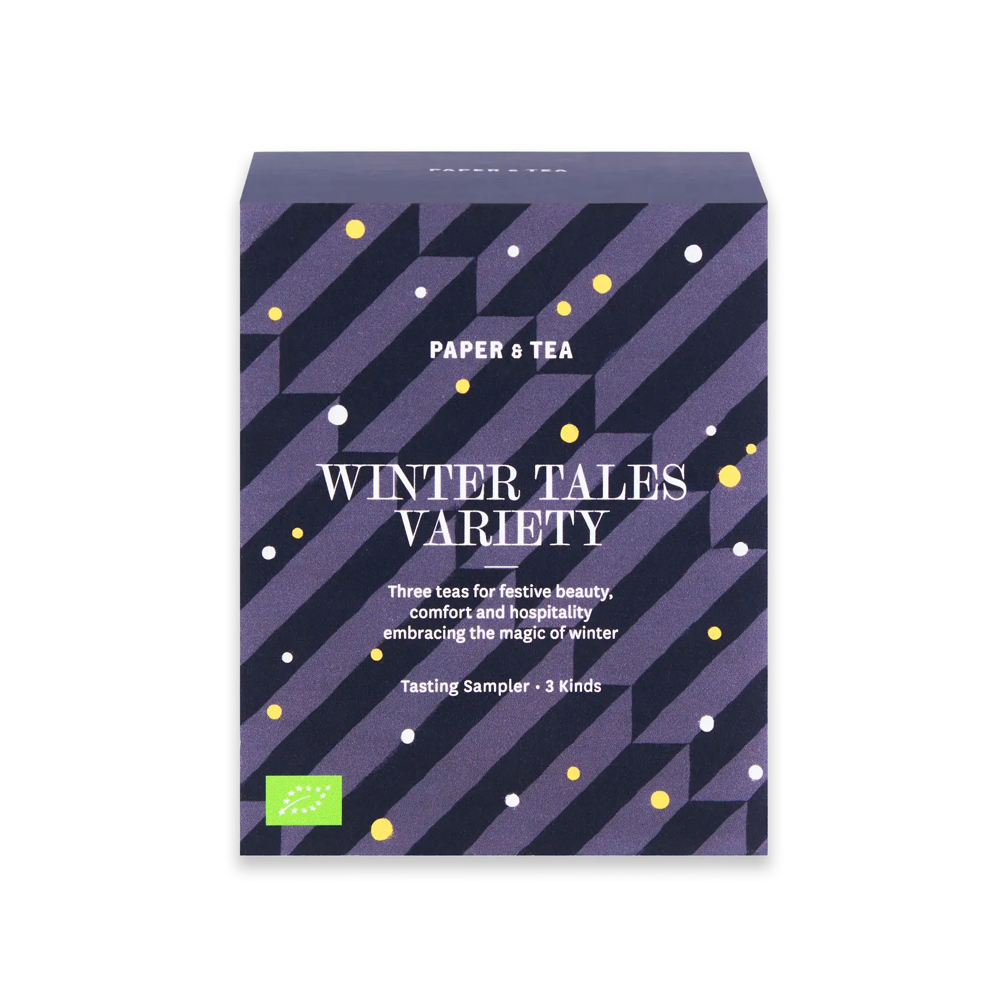 Quadratische Verpackung 'Winter Tales Variety' von PAPER & TEA mit lila-schwarzen Streifen, bio-zertifiziert.