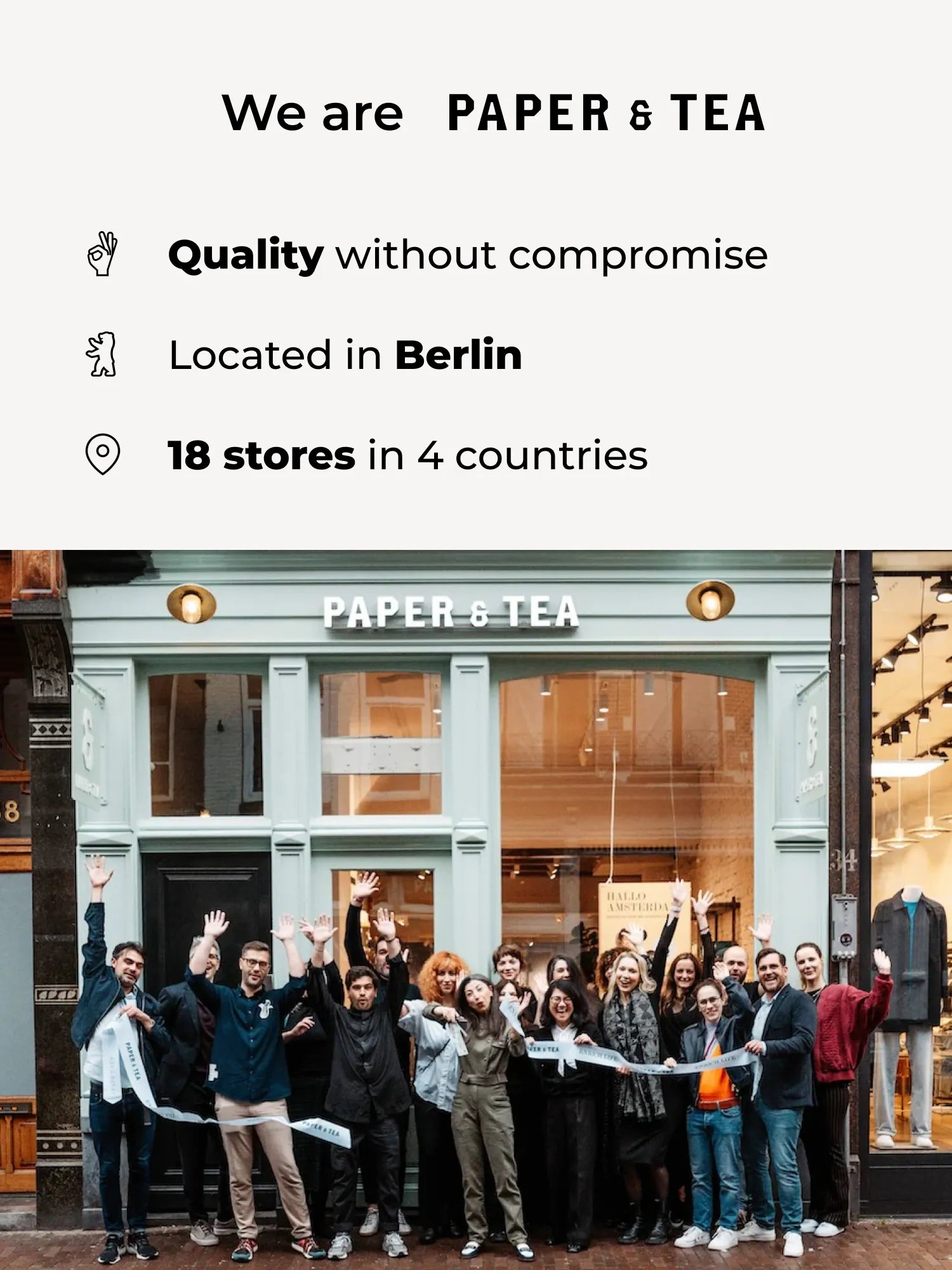 Gruppe von Menschen vor PAPER & TEA Laden mit grün dekoriertem Fenster in Amsterdam